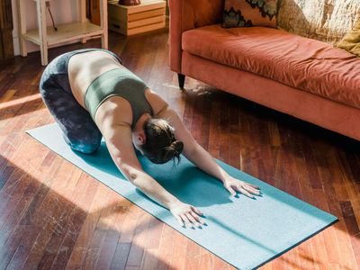 Sun rays hitting a yoga mat in a quiet room.